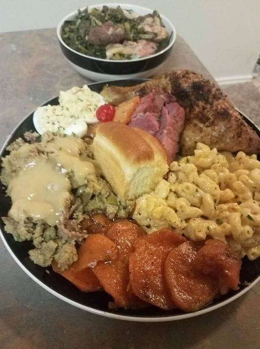 Chicken and dressing, chicken gravy, greens, mac and cheese, deviled eggs, ham, sweet potatoes and dinner roll