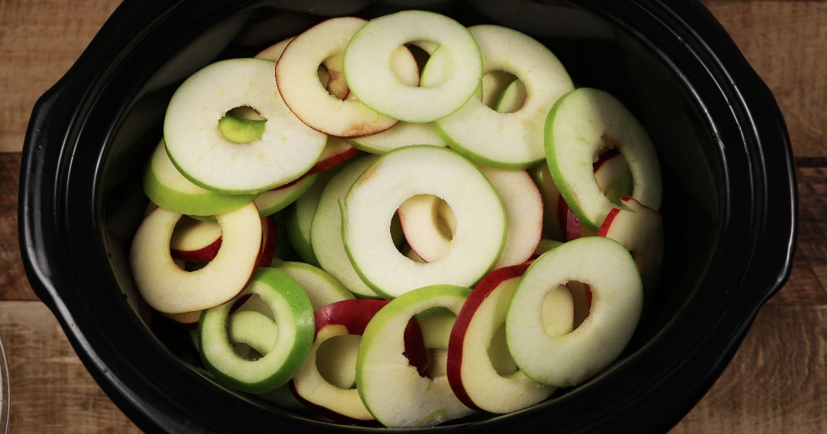 Put apple slices in slow cooker for a delicious dessert you won’t feel guilty eating